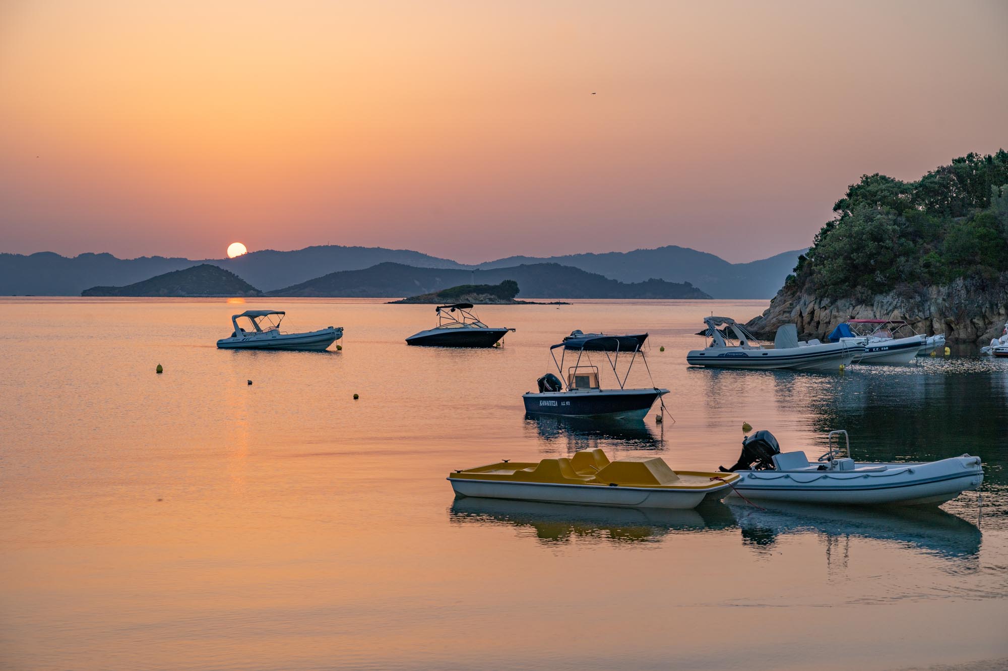 sunrise in Skiathos with boats in the foreground
