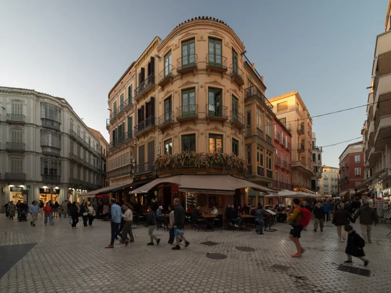 Malaga Architecture Busy street with historic buildings and people