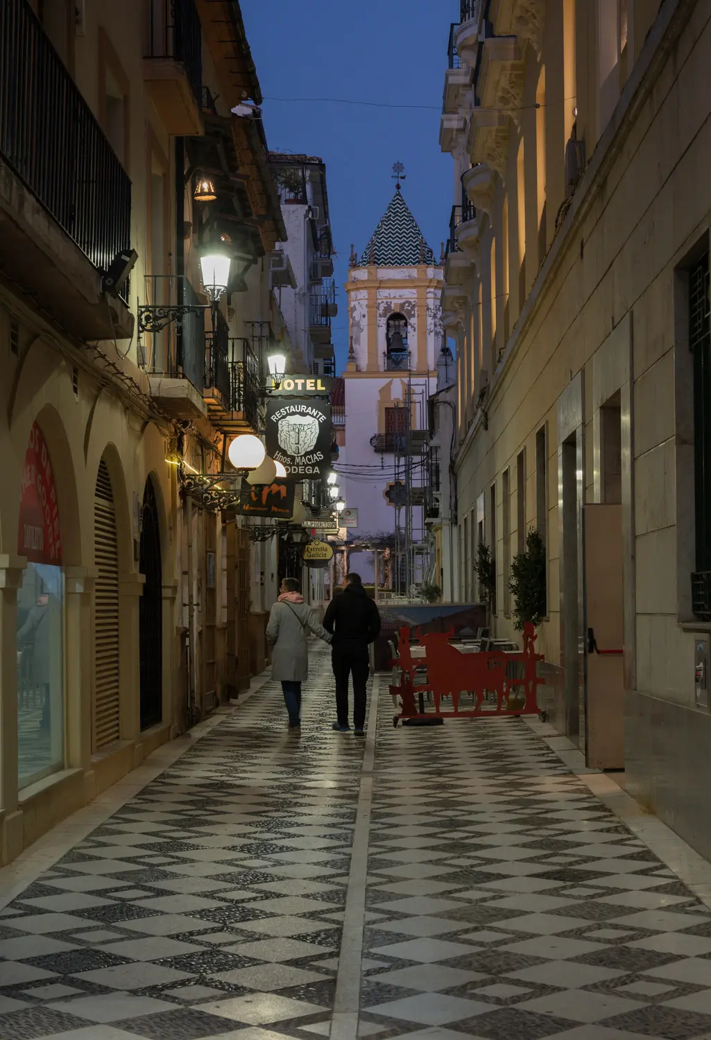 Ronda Streeview Evening Quiet evening street with couple walking